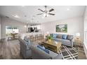 Inviting living room with stylish furnishings, seamlessly connecting to the open kitchen at 6638 Se 108Th Ln, Belleview, FL 34420