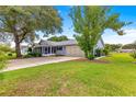 This single-story home includes a side driveway and mature landscaping at 8532 Sw 65Th Court Rd, Ocala, FL 34476