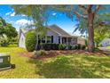 Single-story home with mature landscaping and a screened-in porch at 8532 Sw 65Th Court Rd, Ocala, FL 34476