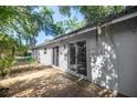 Backyard with multiple sliding glass doors at 9 Juniper Pass Trl, Ocala, FL 34480