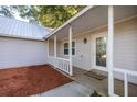 Close up of the front porch with mulched flower bed at 9 Juniper Pass Trl, Ocala, FL 34480