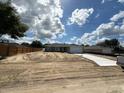 New home construction with a spacious lot and long driveway on a sunny day at 10121 Sw 130Th Ter, Dunnellon, FL 34432