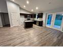 Spacious kitchen features dark wood cabinets, stainless steel appliances, and an island at 12472 Se 67Th Terrace Rd, Belleview, FL 34420