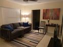 Cozy living room featuring neutral colors, modern decor, and ample natural light at 2215 Ne 16Th Ct, Ocala, FL 34470
