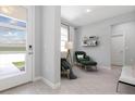 Bright living room featuring two chairs, a window, and tile floors at 2254 Amberly Ave, Orlando, FL 32833