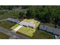 Charming single-story home featuring a new metal roof and a spacious yard perfect for outdoor activities at 2981 Ne 39Th Pl, Ocala, FL 34479