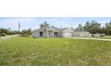 Well-maintained one-story home with lush front lawn and a long driveway at 3079 Sw 168 Pl, Ocala, FL 34473