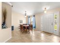 Bright dining room with a large window, a dining table, and beautiful blue curtains and decorations at 3102 Ne 26Th St, Ocala, FL 34470