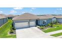A stunning aerial view of the residence showcasing its manicured lawn, complementing neighborhood, and well-maintained surroundings at 6046 Sw 86Th Cir, Ocala, FL 34481