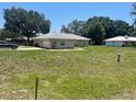 The yard of this home is spacious and freshly cut, located in a quite neighborhood at 6051 Ne 25Th Ave, Ocala, FL 34479