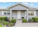 Inviting front porch with decorative plants and a clear view of the home's entrance at 9729 Sw 97Th St, Ocala, FL 34481