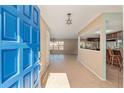 Bright foyer with tiled flooring, starburst chandelier, and open view into the dining and kitchen areas at 1404 Se 40Th Ct, Ocala, FL 34471