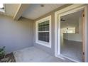 Sunlit entryway showcasing tile flooring and a view into the open-concept living area at 16062 Se 89Th Ter, Summerfield, FL 34491