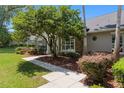 Landscaped front yard with a walkway leading to the main entrance of the residence at 2010 Se 25Th St, Ocala, FL 34471