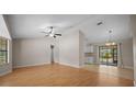 Spacious living room with hardwood floors, neutral-colored walls, and lots of natural light at 23 Larch Crse, Ocala, FL 34480