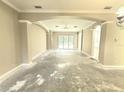 Open living space with decorative columns, large windows, and bright airy atmosphere at 2515 Se 19Th Cir, Ocala, FL 34471