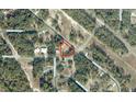 Aerial view of property showing lot lines, and surrounding neighborhood in a wooded area at 27 Locust Radial Crse, Ocala, FL 34472