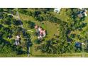Overhead view showcases the home's private lot surrounded by mature trees and greenery at 6381 Sw 21St Court Rd, Ocala, FL 34471
