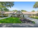 Charming home featuring a cozy front porch, well-kept landscaping, and inviting curb appeal at 8524 Sw 90Th Ln # B, Ocala, FL 34481