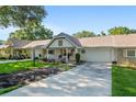 Charming home featuring a cozy front porch, well-kept landscaping, and inviting curb appeal at 8524 Sw 90Th Ln # B, Ocala, FL 34481
