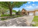 Villa exterior with lawn, driveway, and tree at 9330 Sw 84Th Ter # A, Ocala, FL 34481