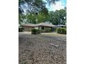 Backyard featuring enclosed pool area and spacious lawn at 1325 Nw 73Rd Ter, Ocala, FL 34482