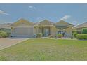 Inviting single-story home featuring a spacious front yard and a serene neighborhood at 14004 Se 94Th Ave, Summerfield, FL 34491