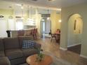 Inviting living room featuring an open floorplan and arched doorways at 14561 Sw 112Th Cir, Dunnellon, FL 34432