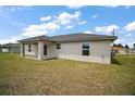 A well-maintained backyard with a covered patio, perfect for outdoor entertaining and relaxation at 20 Emerald Trl, Ocala, FL 34472