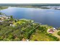 Stunning aerial view showcasing the lakefront property with its natural surroundings at 23797 Ne 189Th St, Fort Mc Coy, FL 32134