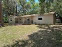 Charming single-story home with a welcoming front porch and a well-maintained lawn at 312 Nw 28Th St, Ocala, FL 34475