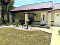Charming single story house featuring a quaint front porch with white rock landscaping at 340 Oak Track Loop, Ocala, FL 34472
