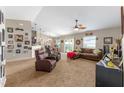 Spacious living room featuring plush carpeting, a ceiling fan, and seamless flow to dining at 3887 Sw 156Th Pl, Ocala, FL 34473