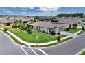 View of a well-maintained house on a corner lot with manicured lawns and flowerbeds at 5634 Sw 91St Ave, Ocala, FL 34481