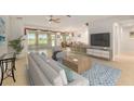 Bright living room with neutral tones, stylish decor and tile flooring at 9511 Sw 71St Loop, Ocala, FL 34481