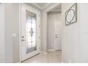 Bright entryway with tiled floors and decorative glass front door at 9658 Sw 76Th Lane Rd, Ocala, FL 34481