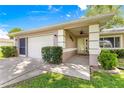 Charming single Gathering home with a two car garage and well-maintained landscaping at 10016 Sw 62Nd Cir, Ocala, FL 34476