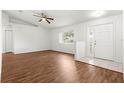 Open concept living area featuring laminate floors, fan and natural light at 10016 Sw 62Nd Cir, Ocala, FL 34476