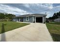 Attractive single-story home with an attached garage and a concrete driveway at 1100 Nw 126Th Ln, Citra, FL 32113