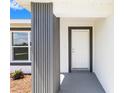 Covered front entryway showing stylish trim and a freshly painted front door at 16697 Sw 30 Avenue Rd, Ocala, FL 34473