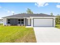Attractive single-story home with a two-car garage and freshly laid lawn at 16697 Sw 30 Avenue Rd, Ocala, FL 34473