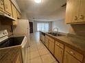 Functional kitchen featuring granite countertops, wooden cabinets and white appliances at 1910 Sw 34Th Ct, Ocala, FL 34474