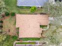 Aerial view of the home showcasing the roof, landscaping, and proximity to neighboring properties at 19586 Sw 84Th Pl, Dunnellon, FL 34432