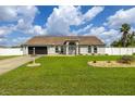 Charming single-story home featuring a well-manicured lawn and an attached garage at 2671 Sw 158Th Lane Rd, Ocala, FL 34473