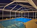Indoor pool area with ambient lighting, perfect for evening swims and relaxation at 2671 Sw 158Th Lane Rd, Ocala, FL 34473