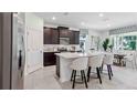 Modern kitchen with stainless steel appliances and a spacious center island at 3066 Canopy Oak Blvd, Wildwood, FL 34785