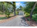 Charming single-story home with an attached garage and a long driveway at 4701 Nw 60Th Terrace, Ocala, FL 34482