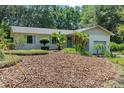 Charming single-story home with a well-manicured lawn and lush landscaping at 4701 Nw 60Th Terrace, Ocala, FL 34482