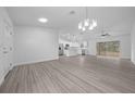 Bright open-concept layout with views of the kitchen and outdoor space at 7 Walnut Pl, Ocala, FL 34480