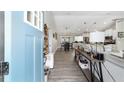 Open entryway with views of the living room, dining area, and kitchen at 7442 Sw 129Th Ln, Ocala, FL 34473